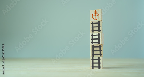 MVP, minimum viable product concept for lean startup. Life cycle of product development. Analysis and market validation. Wooden cubes with ladder and new product launching icons. photo