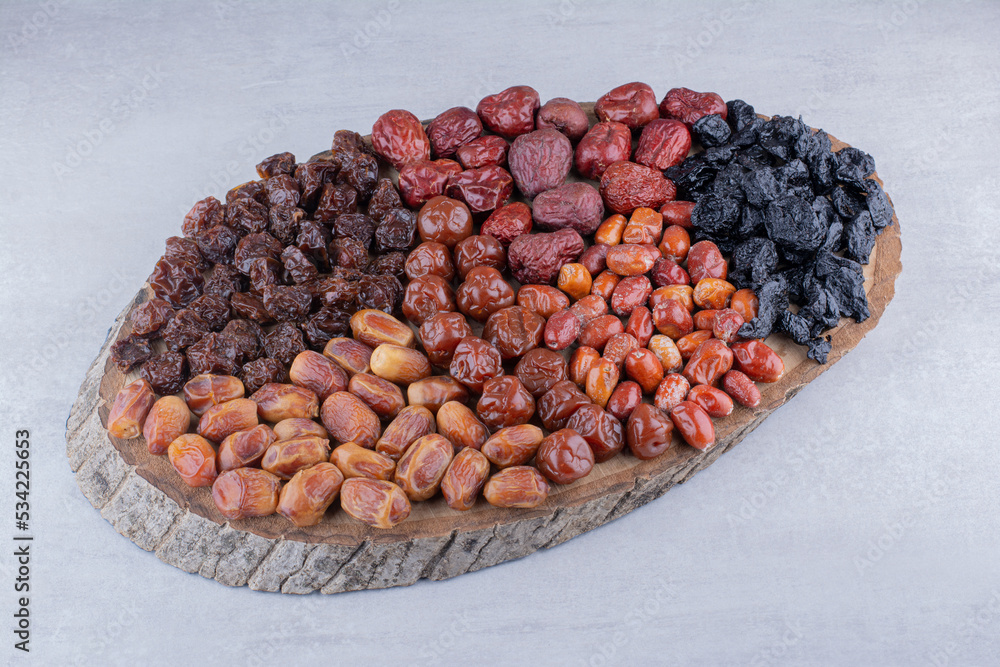 Dry fruits combination on a wooden platter Dry fruits combination on a wooden platter