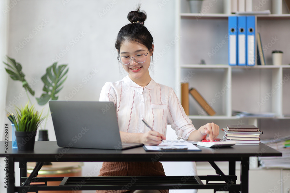 Business woman accountant working in office checking financial accounts and allocating company budgets. Business woman accountant working in office checking financial accounts and allocating company budgets.