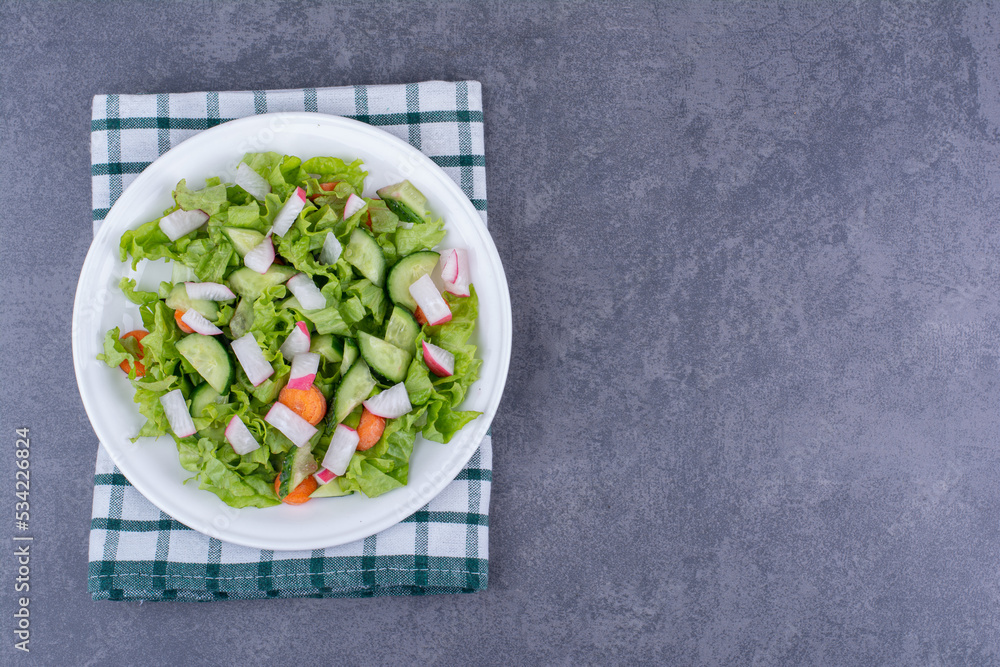 Green salad in a plate with mixed ingredients Green salad in a plate with mixed ingredients