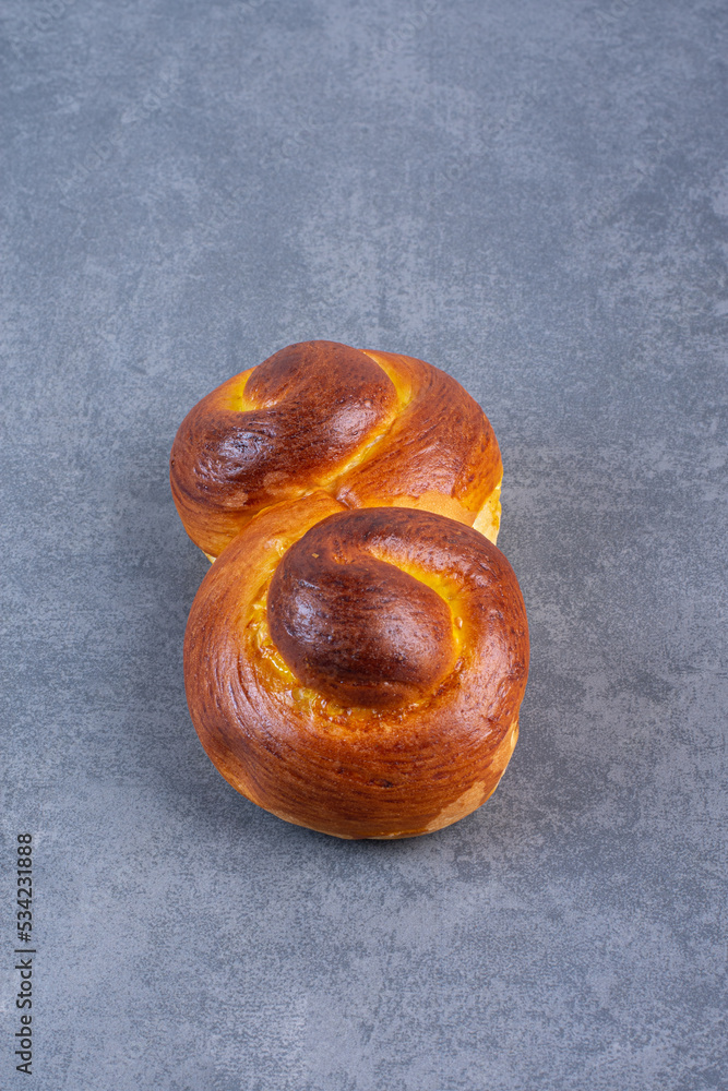 Obraz premium Swirly sweet bun on marble background