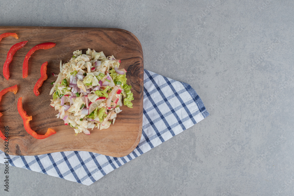 Cabbage and lettuce salad on a wooden board Cabbage and lettuce salad on a wooden board