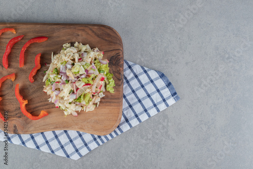 Cabbage and lettuce salad on a wooden board