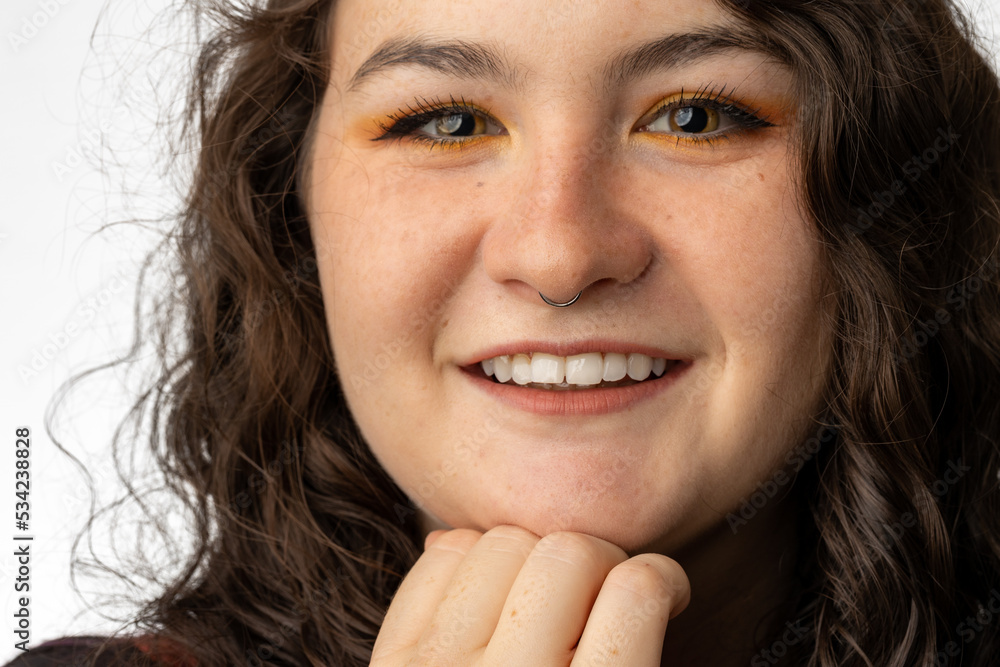 Young lady smiling at camera, with pierced nose. Young lady smiling at camera, with pierced nose.