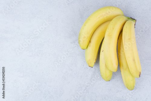 Bunch of ripe fruit bananas on white background