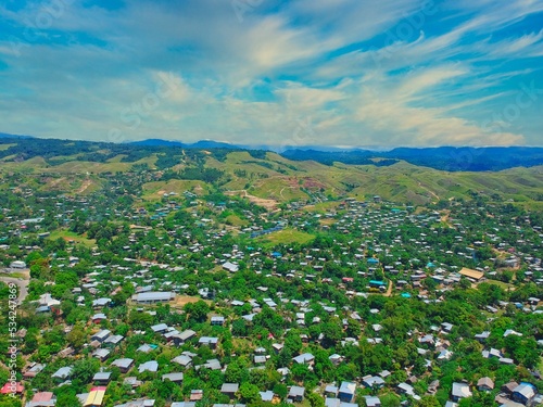 Aerial of houses and nature with the background of mountains in East Honiara, Solomon Islands