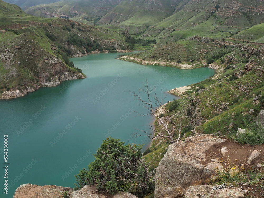 Natural monument, mountain lake Gizhgit with deep green water. Elbrus region, Kabardino-Balkarian Republic, Russia.