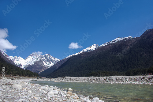 The Yumthang Valley or Sikkim Valley of Flowers sanctuary, beautiful river and valley of sikkim in a sunny morning of winter season, North Sikkim, INDIA. photo