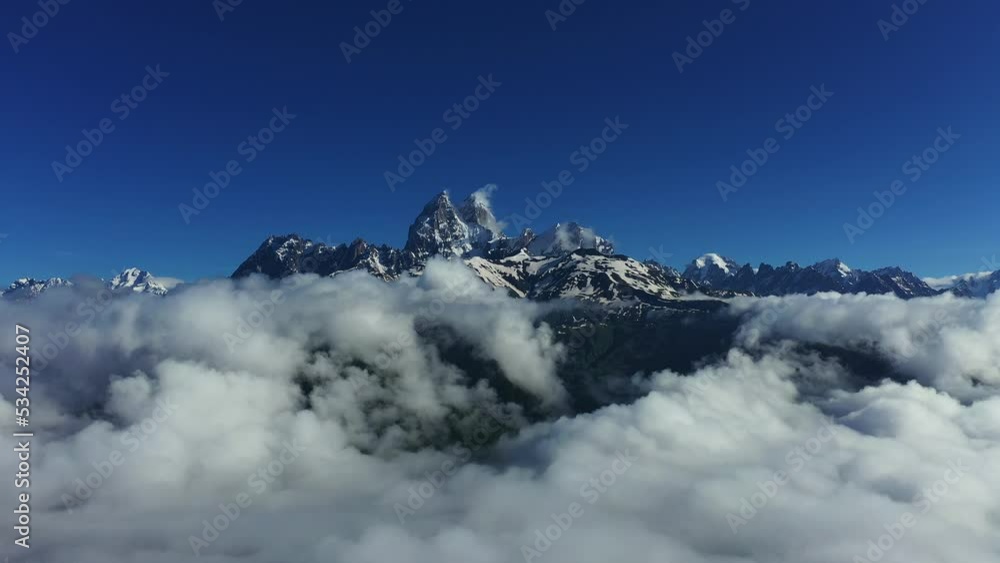 Aerial view of Ushba mountains is one of the most notable peaks of the Caucasus Mountains. It is located in the Svaneti region of Georgia. Aerial view of Ushba mountains is one of the most notable peaks of the Caucasus Mountains. It is located in the Svaneti region of Georgia.