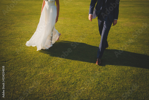 bride and groom on the grass