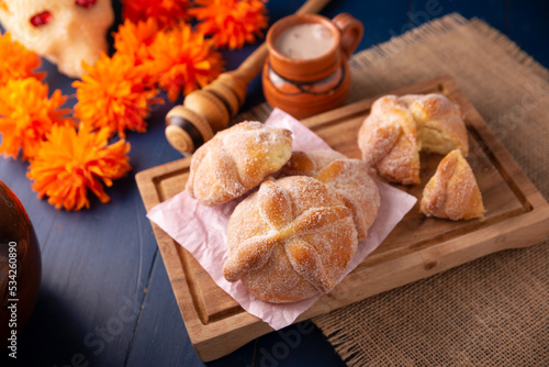 Pan de Muerto. Typical Mexican sweet bread that is consumed in the season of the day of the dead. It is a main element in the altars and offerings in the festivity of the day of the dead. photo