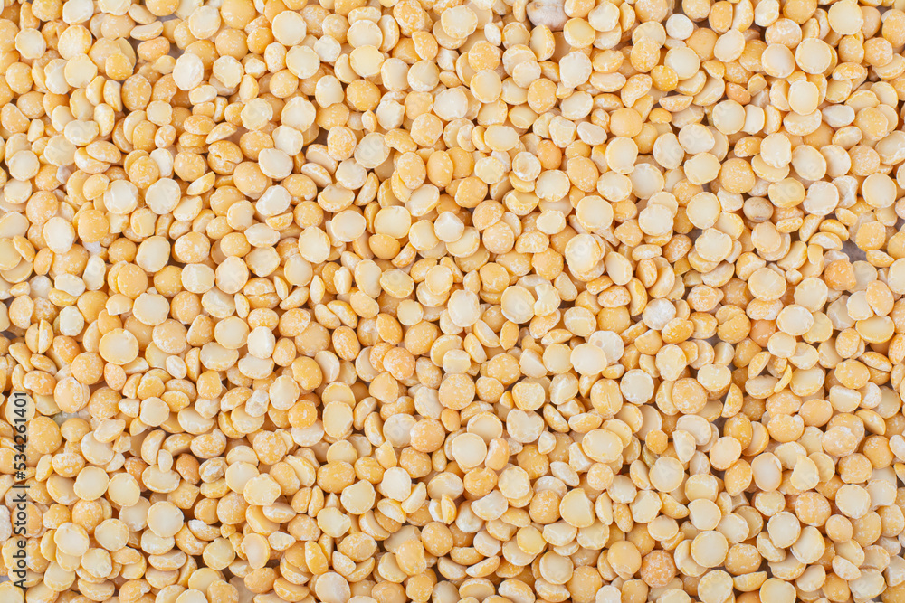 Large pile of dry, yellow lentil Large pile of dry, yellow lentil
