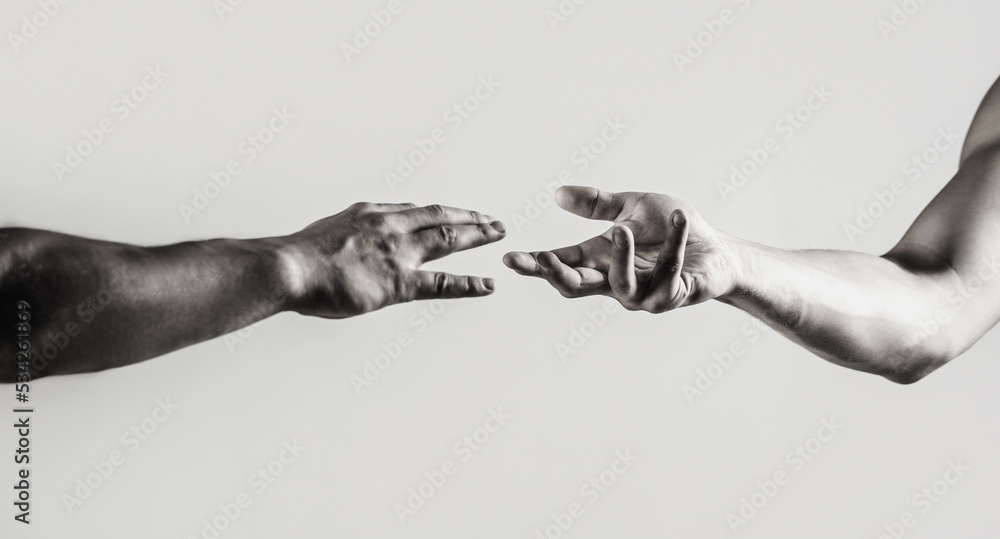 Fototapeta premium Close up help hand. Helping hand concept, support. Friendly handshake. Two hands, shaking hands. Black and white