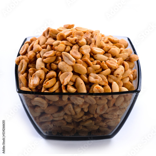 pile of spiced peanuts isolated close up on white background 