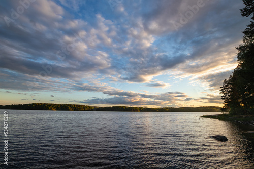 Sunset over lake tranquil landscape