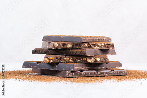Stack of chocolate bars decorated with cocoa powder