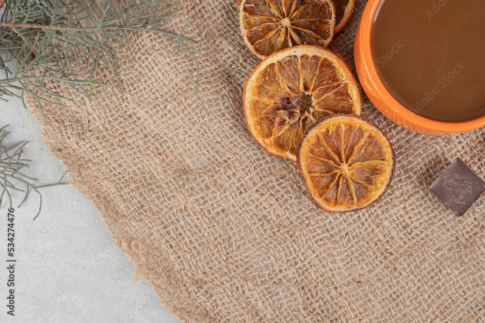 Aroma coffee, orange slices and chocolate on burlap Aroma coffee, orange slices and chocolate on burlap