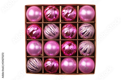 Pink glitter Christmas tree balls in cardboard craft box isolated on white background. Top view