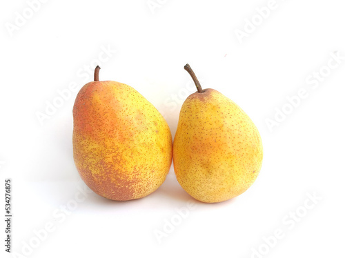 Delicious juicy yellow two pears close-up on a white background