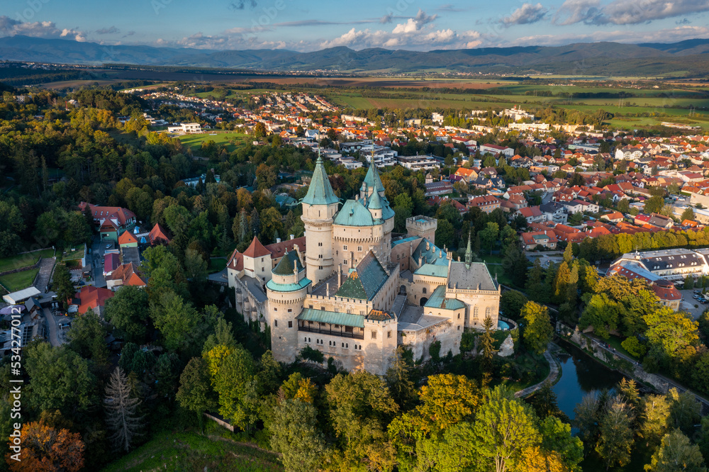 drone view of Bojnice Castle in Slovakia in warm evening light