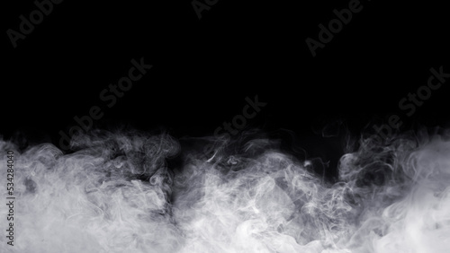 Abstract fog. White cloudiness, mist, or smog moves on black background. Beautiful swirling gray smoke. Mockup for your logo. Wide-angle horizontal wallpaper or web banner.