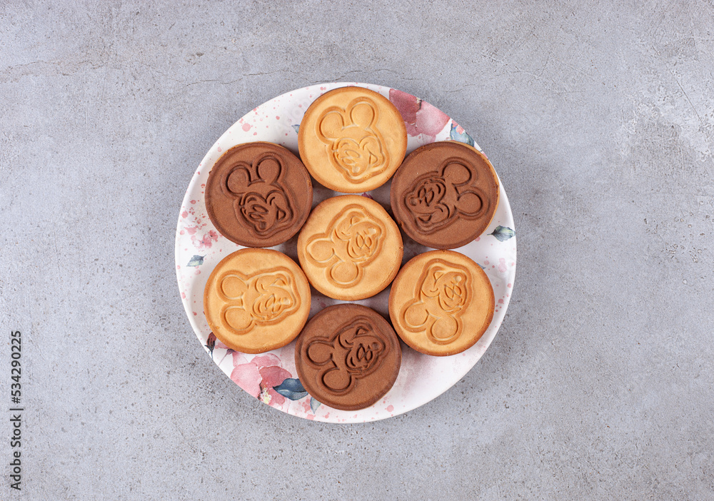 Fototapeta premium Tart cookies on decorated plate on marble background