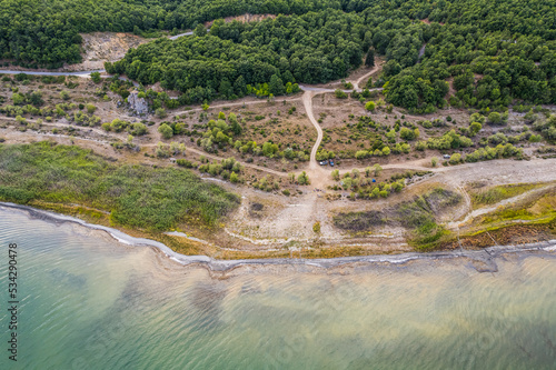 Aerial view of Ohrid-Prespa Transboundary Biosphere Reserve in National Park Galicica in North Macedonia, shore of Prespa lake in sunset photo