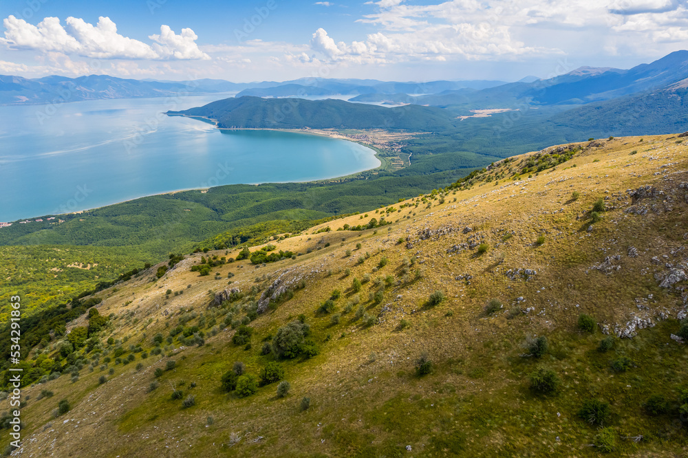 Aerial view of Ohrid-Prespa Transboundary Biosphere Reserve in National Park Galicica in North Macedonia of hill above Prespa lake Aerial view of Ohrid-Prespa Transboundary Biosphere Reserve in National Park Galicica in North Macedonia of hill above Prespa lake