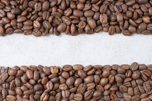 Bunch of coffee beans on stone background