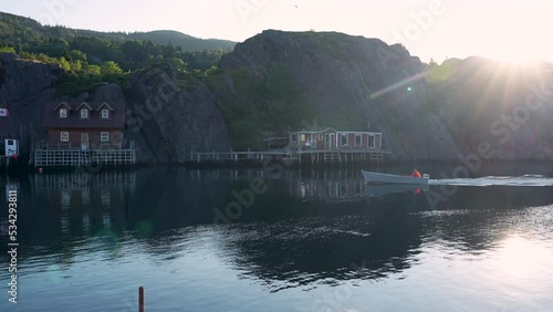 A small boat returns to placid QuIdi Vidi Harbour