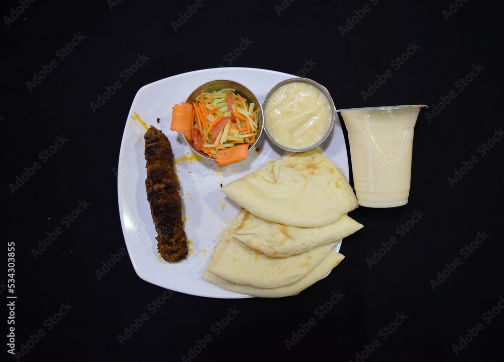 Beef Kebab or kabab with Naan Ruti. Beef shik kabab or tikka. Indian Beef shekh kebab with salad