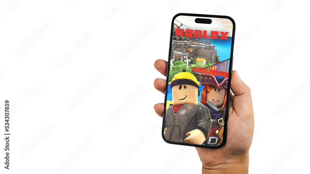Child holding a smartphone iPhone 14 Pro with Roblox mobile game app app on  the screen. White background. Rio de Janeiro, RJ, Brazil. September 2022  Photos | Adobe Stock