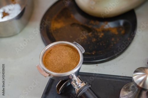 Barista making a cup of coffee soft focus image 