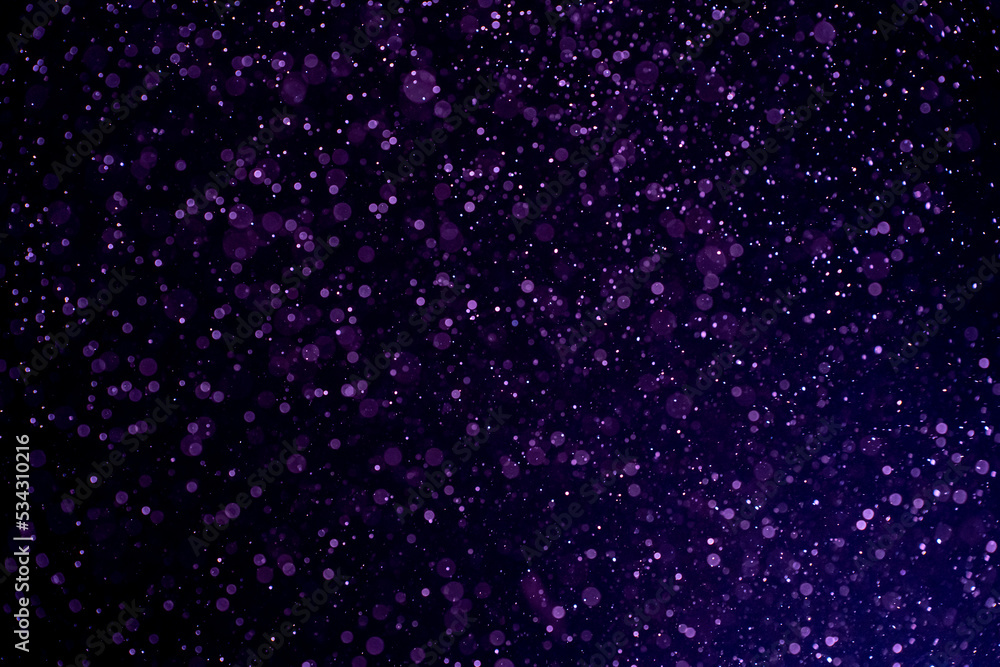 Dust blue particles on black background. Glittering sparkling bokeh overlay with copy space for text. Dust blue particles on black background. Glittering sparkling bokeh overlay with copy space for text.