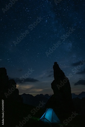 Silhouettes of rock formations on Campanile di Val Montanaia mountain peak in Italy at night photo