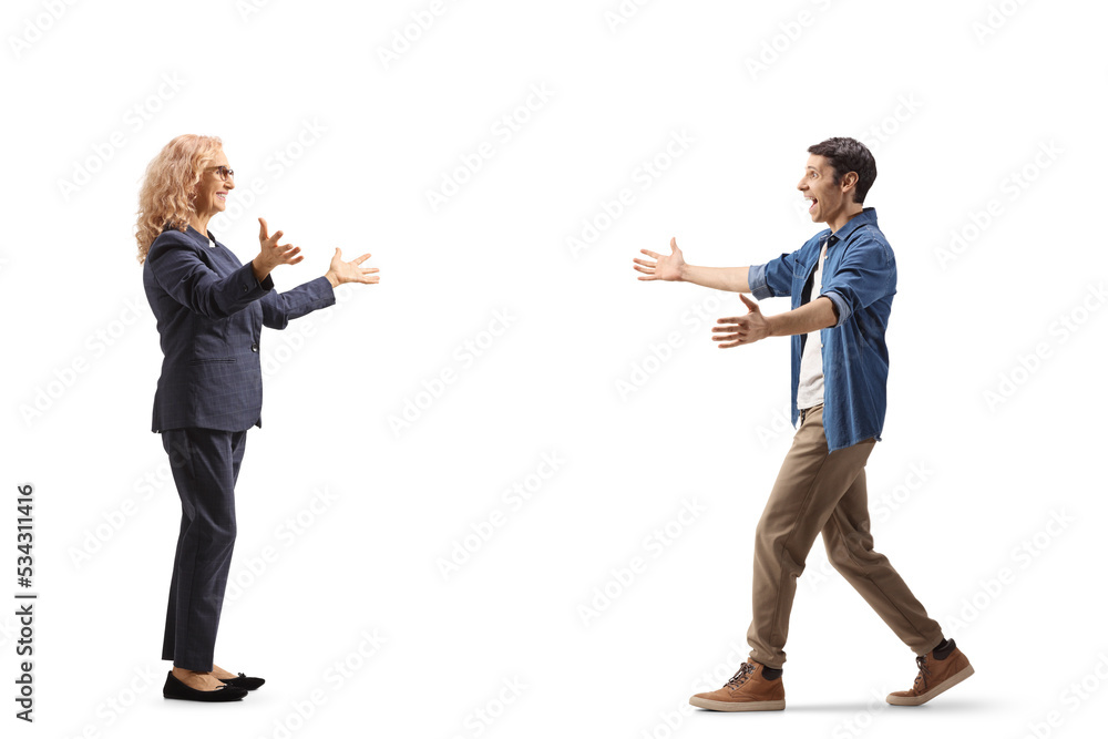 Full length profile shot of a casual young man walking towards a woman with arms wide open Full length profile shot of a casual young man walking towards a woman with arms wide open