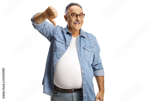 Foto Sarcastic mature man gesturing thumbs down