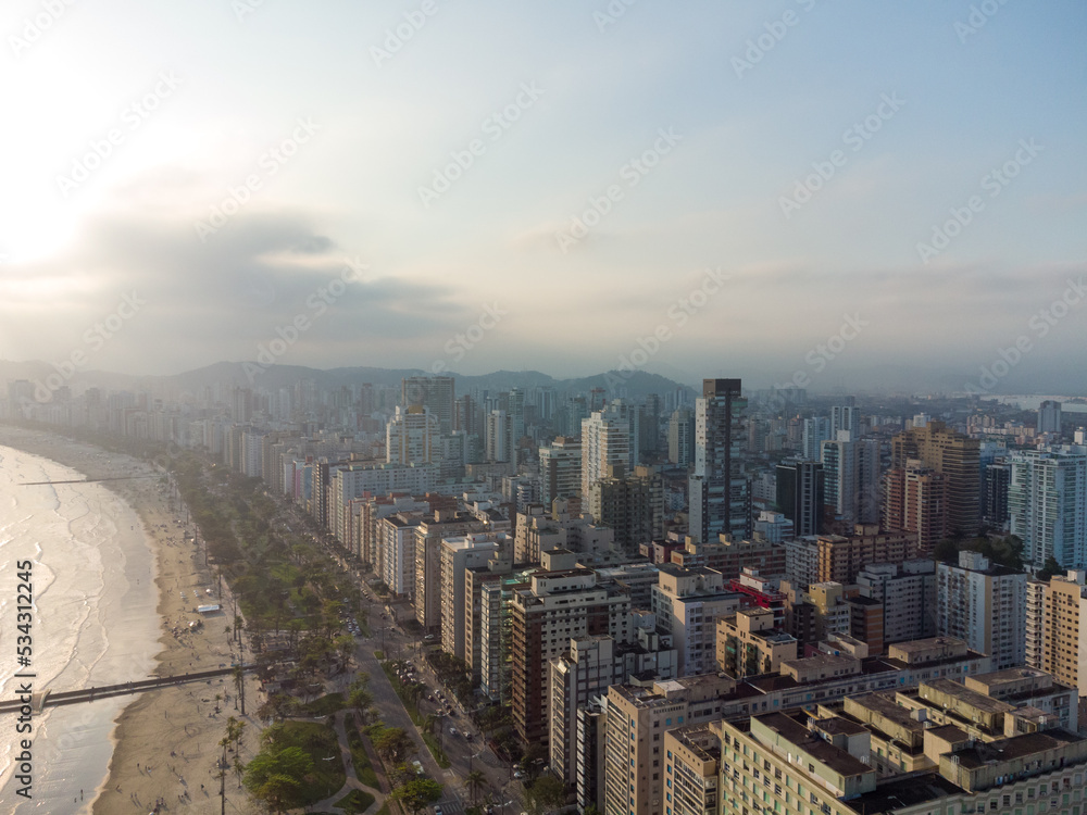 Fototapeta premium Aerial view of the waterfront to the ocean with its high buildings in the city of Santos in Brazil