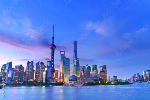 View of the skyline along the riverside at sunrise in Shanghai, China. © Javen