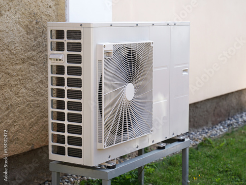 Obraz na płótnie Heat pump or air conditioning outdoor unit in modern house of future using green electric energy, heat pump - efficient source of heat w salonie