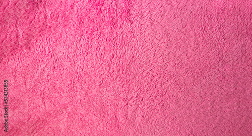 Texture of fluffy pink material as background for your image. Soft fabric surface