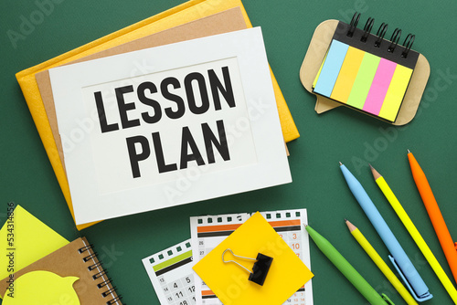 Lesson Plan. Word on a sheet for notes with a calendar in the background.Information concept