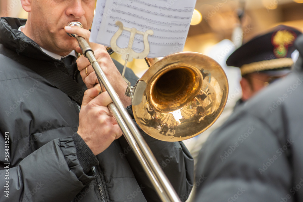Obraz premium Musician From A Popular Band Playing Trumpet During A Religious Procession