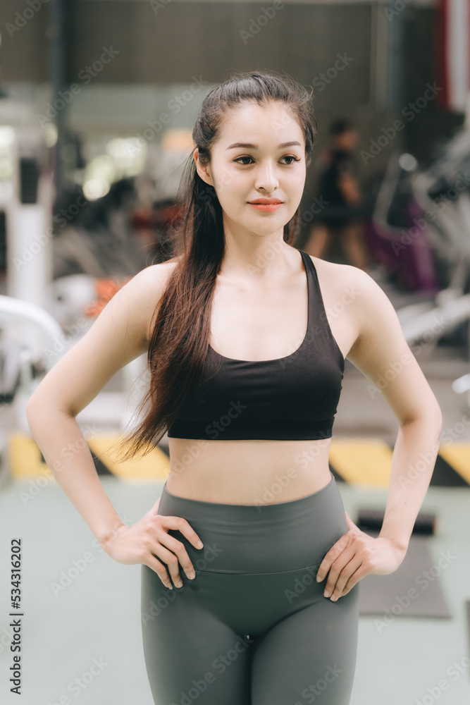 Asian female fitness athlete in gym Asian female fitness athlete in gym