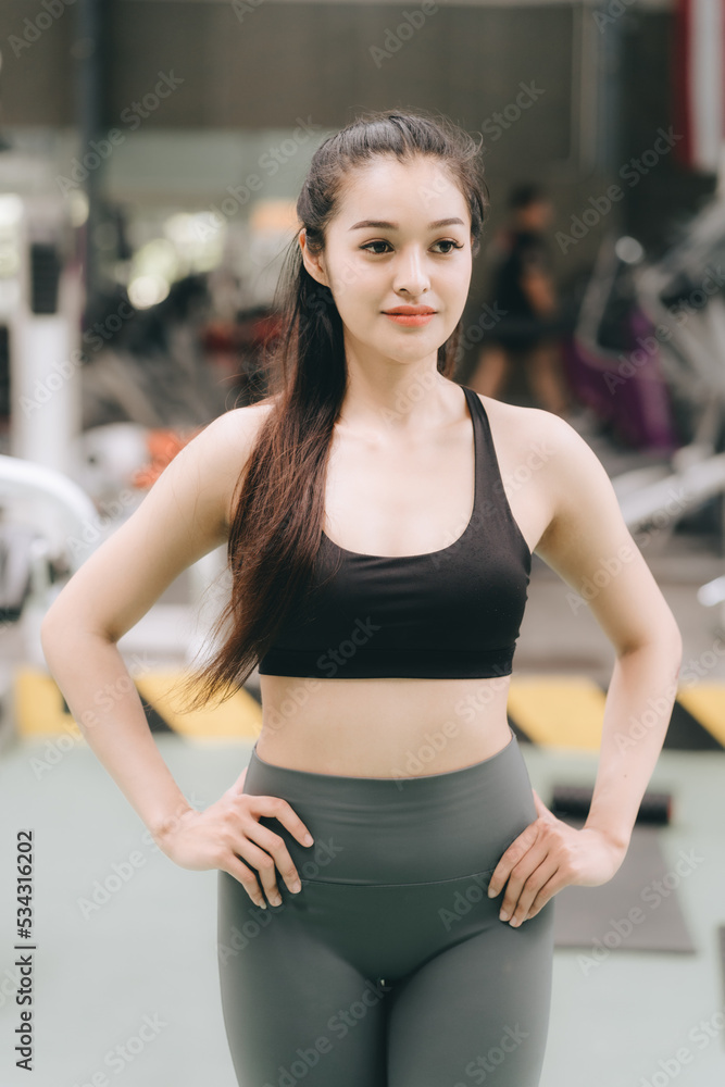 Asian female fitness athlete in gym