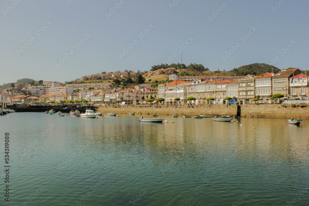 landscape of Baiona, Spain seen from the beach on a sunny day