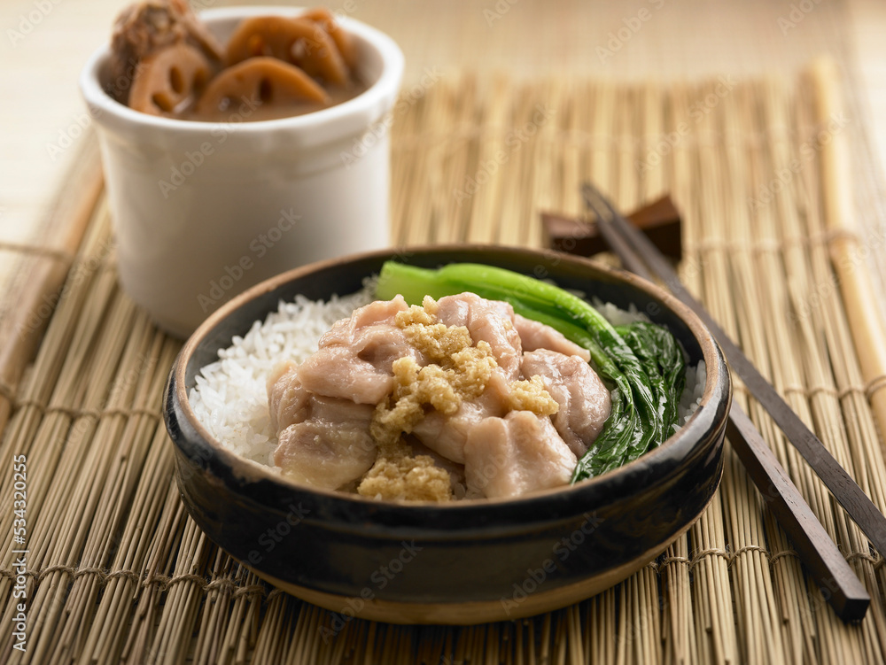Steamed Rice with Chicken and Samsui Ginger Sauce served in a dish isolated on table side view