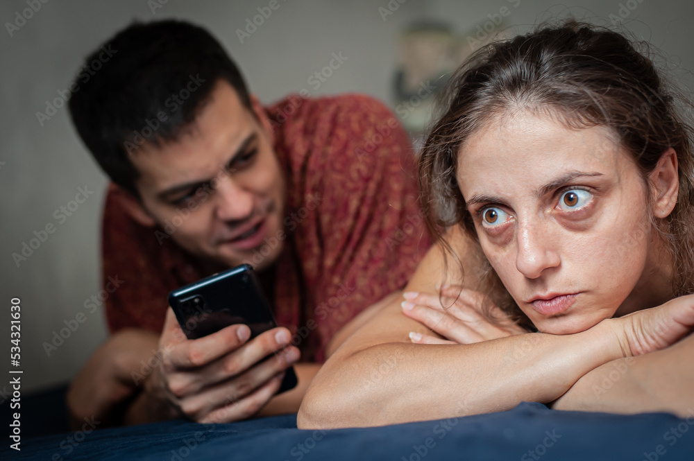 Concept of adultery and infidelity. Shocked and surprised jealous girl in trouble with her boyfriend who is cheating on her with her friend. Broken feelings. Concept of adultery and infidelity. Shocked and surprised jealous girl in trouble with her boyfriend who is cheating on her with her friend. Broken feelings.