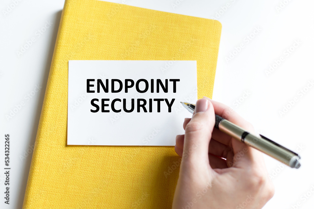 Business concept. Text ENDPOINT SECURITY The text on the card is written by the hand of a person on a bright table Business concept. Text ENDPOINT SECURITY The text on the card is written by the hand of a person on a bright table