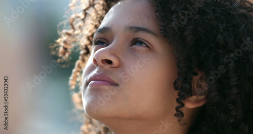 Child face looking at sky, close-up kid looks up